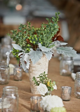 white vase with greenery on wedding table